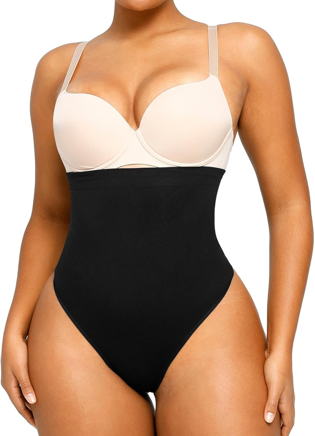 The Sculpting Essential high-waisted seamless thong in black offers tummy control and a smooth silhouette under clothing. Ideal shapewear for everyday wear.