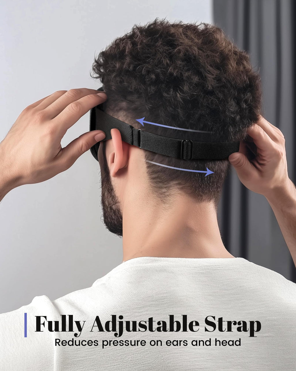 Man adjusting The Midnight Muse | 3D Silk-Touch Blackout Mask with fully adjustable strap for custom fit and reduced pressure on ears and head.