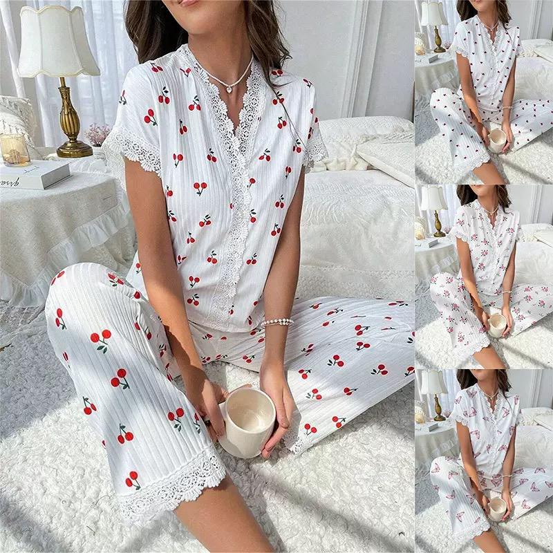 White cherry print pajama set with lace trim, featuring short sleeves and button-up top, perfect for stylish loungewear.