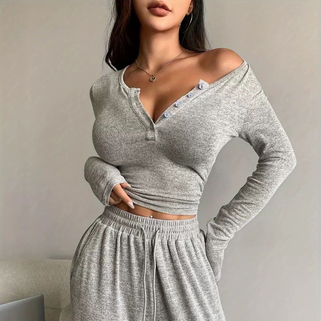 Gray long sleeve henley top and drawstring pants, a soft and fitted loungewear set for stylish comfort at home.