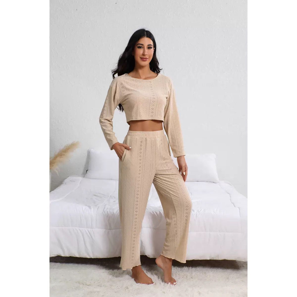 Beige long sleeve crop top and matching pants with delicate knit pattern, a chic and breathable pajama set for lounging.