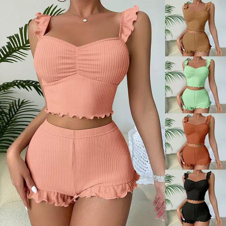 Peach ribbed lounge set from The Aria Romantique, with ruffle trim and available in multiple colors. Seductress Beauty stylish sleepwear.