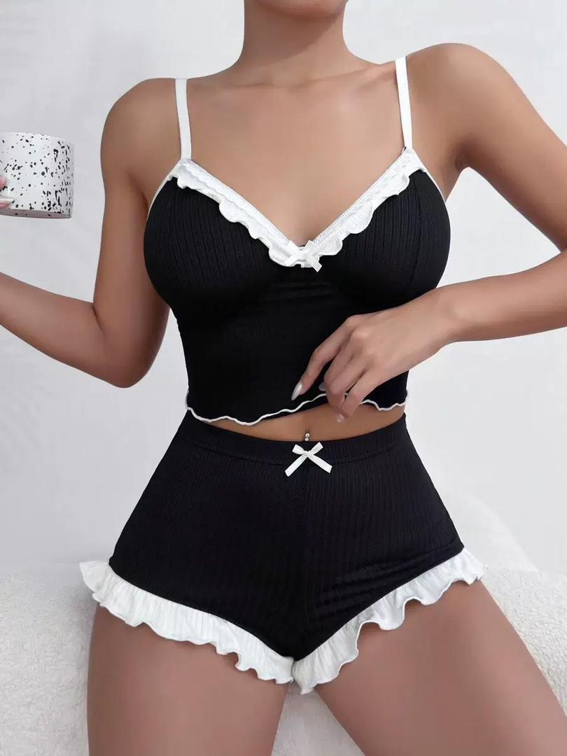 The Aria Romantique black lounge set with white lace trim, includes a soft cami top and high-waisted shorts. Seductress Beauty luxury sleepwear.
